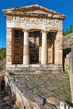 Ancient Greek Doric columns and entablature of the Athenian Treasury, Delphi, Greece, c.525 BC[15]