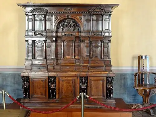 Wardrobe; c.1530; carved walnut; height: 230&nbsp;cm; Château d'Écouen[49]