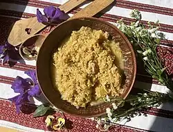 A bowl of cooked shredded cabbage with millet