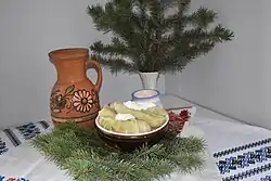 A bowl of cabbage rolls with a dollop of sour cream