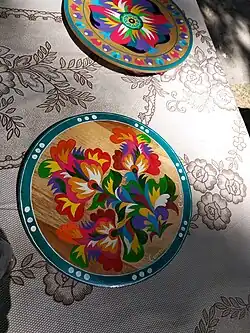 Two plates with colorful floral ornaments