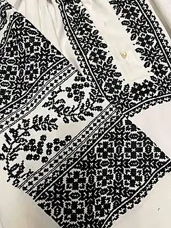 Fragment of an embroided shirt