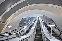 Bottom of the escalators