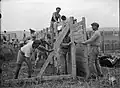 Construction of stockade wall, 1 April 1937