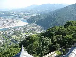 View of Iwakuni City, Yamaguchi Prefecture from Iwakuni Castle. The famous Kintai Bridge can be seen over the Nishiki River.