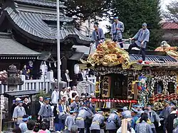 Decorated float with festival participants.