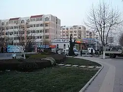 Large, square buildings, seen from the street