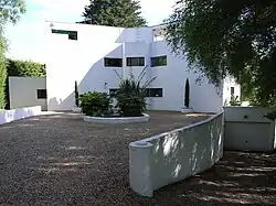 High and Over with attached walls, steps and pergola