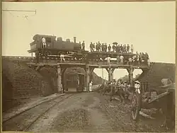 The picture shows the modernized old Korea. King 'Kojong' believed that the new western technology such as electricity, streetcars, gold mining, and railroads could made the nation wealthy and strong. The location is probably at the outskirts of Seoul, where the new tramcar was installed in 1899.