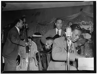 Singer Nat King Cole and his band