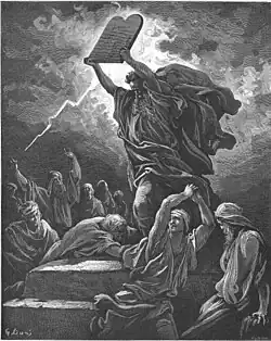 Old-fashioned engraving: a bearded man holds a stone tablet over his head, ready to shatter it, while lightning strikes behind him.