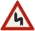 111-10 – Double curve, to the left (formerly used )