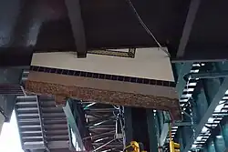 Wall-Slide detail beneath the mezzanine, over street level