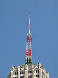 An antenna tower 146 feet (45&nbsp;m) tall in San Antonio, TX with its red and white aircraft warning paint visible