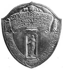 Black and white photograph of a silver challenge shield