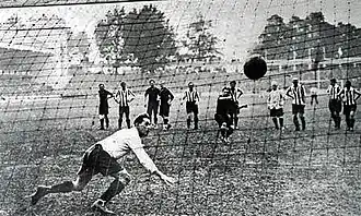 A successful penalty kick, seen from the back of the net