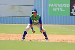 Image 11Baserunners generally stand a short distance away from their base between pitches, preparing themselves to either go back or steal the next base. (from Baseball rules)