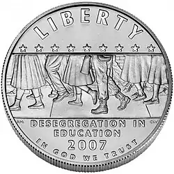 Coin showing the lower legs of Little Rock Central High students and soldiers