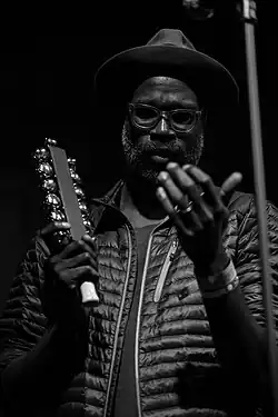 Tunde Adebimpe performing with TV on the Radio in 2015