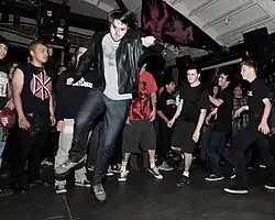 Punks skanking to a concert by Oakland band Smokers.