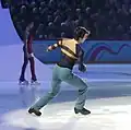 Stéphane Lambiel begins to take off by hitting the ice with his left toe pick