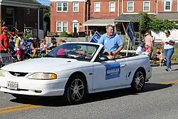 Gansler sits in the back of his car in the July 4 parade in Dundalk, Maryland