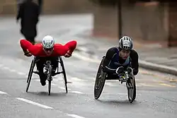 2023 TCS London Marathon - Elite wheelchair race - Tomoki Suzuki (W143) leading Jetze Plat (W158) between mile 16 and 17.