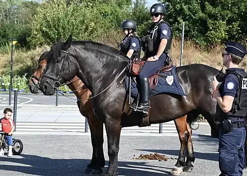 A pair of a police outside of a velodrome