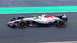 Max Verstappen driving the Red Bull RB21 at the 2025 Japanese Grand Prix in its special white-and-red Honda livery