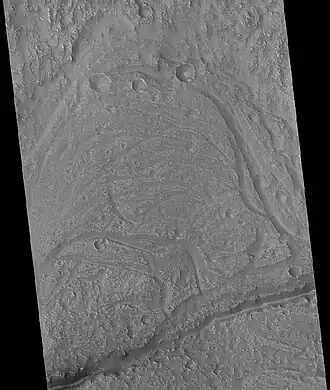 Stream meander and cutoff, as seen by HiRISE under HiWish program. This is part of a major drainage system in the Idaeus Fossae region.