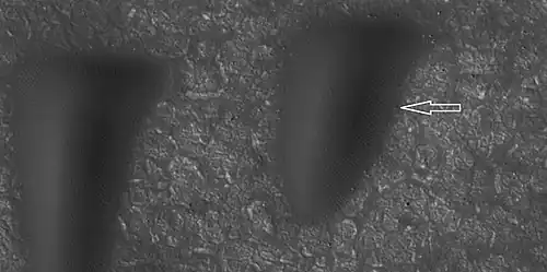 Boulder and boulder tracks, as seen by HiRISE under HiWish program The arrow shows a boulder that has made a track in the sand as it rolled down dune. Location is Mare Boreum quadrangle.