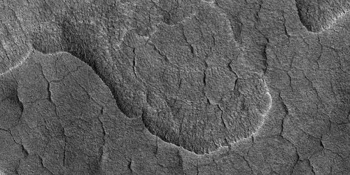 Scalloped terrain, as seen by HiRISE under HiWish program The location is the Casius quadrangle. Studies suggest that there is water-ice in scalloped terrain.