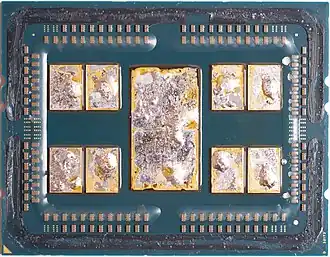 AMD EPYC 7702 after delidding, with remains of solder thermal interface material (TIM).