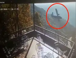 A CCTV still of the aircraft flying low, seconds before the crash