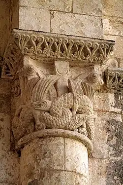 Capital retaining Corinthian form decorated with intertwined beasts derived from Irish manuscripts. Grande-Sauve Abbey, France