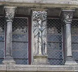 Carving of Adam and Eve on the mullion of a window at the House of the Vicomte of Saint-Antonin-Noble-Val, Tarn-et-Garonne.