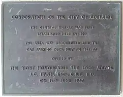 Plaque marking the opening of the redeveloped Adelaide Central Market Buildings by Lord Mayor James Irwin on 17 June 1966. Currently located at the Grote Street entrance.