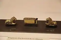A set of gold armbands in the form of two lions and a box made by Ahmose I from Ahhotep II's tomb