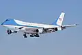 A VC-25 Air Force One with landing gear down