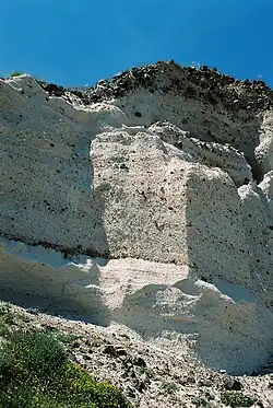 Two layers of pumice, first major phase of the Late-Bronze-Age volcano eruption (~1500 BC), southern part of the caldera island Thera/Santorini. The lower layer is finer, almost white and without intrusions.