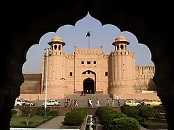 Entrance gate to a fort flanked by two large towers.
