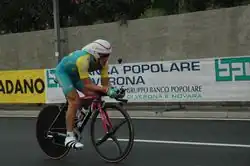 A cyclist riding a bike while in an aerodynamic position.