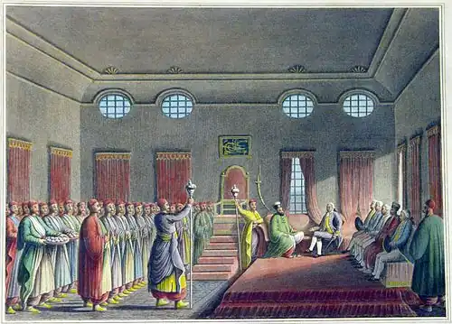 Painting of two statesmen on a couch, surrounded by other men