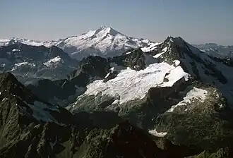 Aerial view looking over the top of Martin Peak at Bonanza (right), and Glacier Peak.