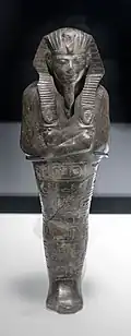 Ushabti of Amenhotep II; 1427–1400&nbsp;BC; serpentine; 29 × 9 × 0.65&nbsp;cm, 1.4&nbsp;kg; British Museum (London)
