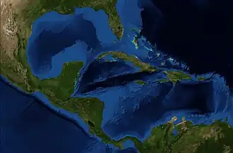 Satellite image of the Caribbean Sea, with Florida located at the top, Central America located on the left, the northern coast of South America at the bottom, and Caribbean islands in the center.