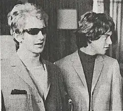 monochrome photograph of Andrew Oldham and Mick Jagger in 1966