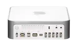 Back panel of a Late 2009 3,1 model Mac Mini. Ordered from left to right, top row: power button, ventilation holes, Kensington lock slot, audio in, audio out. Bottom row: DC in, gigabit Ethernet, FireWire 800, Mini DVI, Mini-DisplayPort, 5 USB 2.0 ports