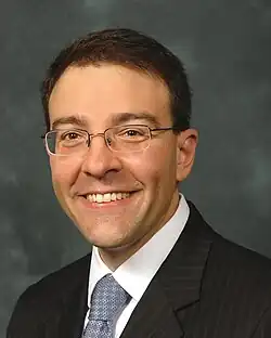 Head and shoulders of a Caucasian man wearing a suit