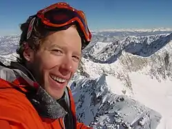 Aron Ralston standing in the snow on the top of Capitol Peak